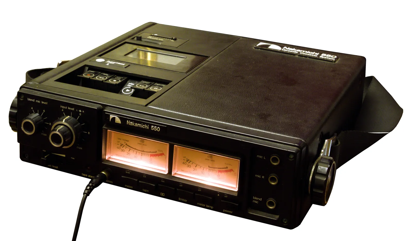 A Nakamichi 550 portable cassette deck from 1974, photographed on white: textured black panel, chrome transport keys, two detented level knobs, and two amber-lit VU meters.